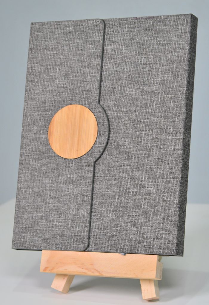 Stylish grey fabric folder with wooden accent on a small easel, perfect for modern office settings.
